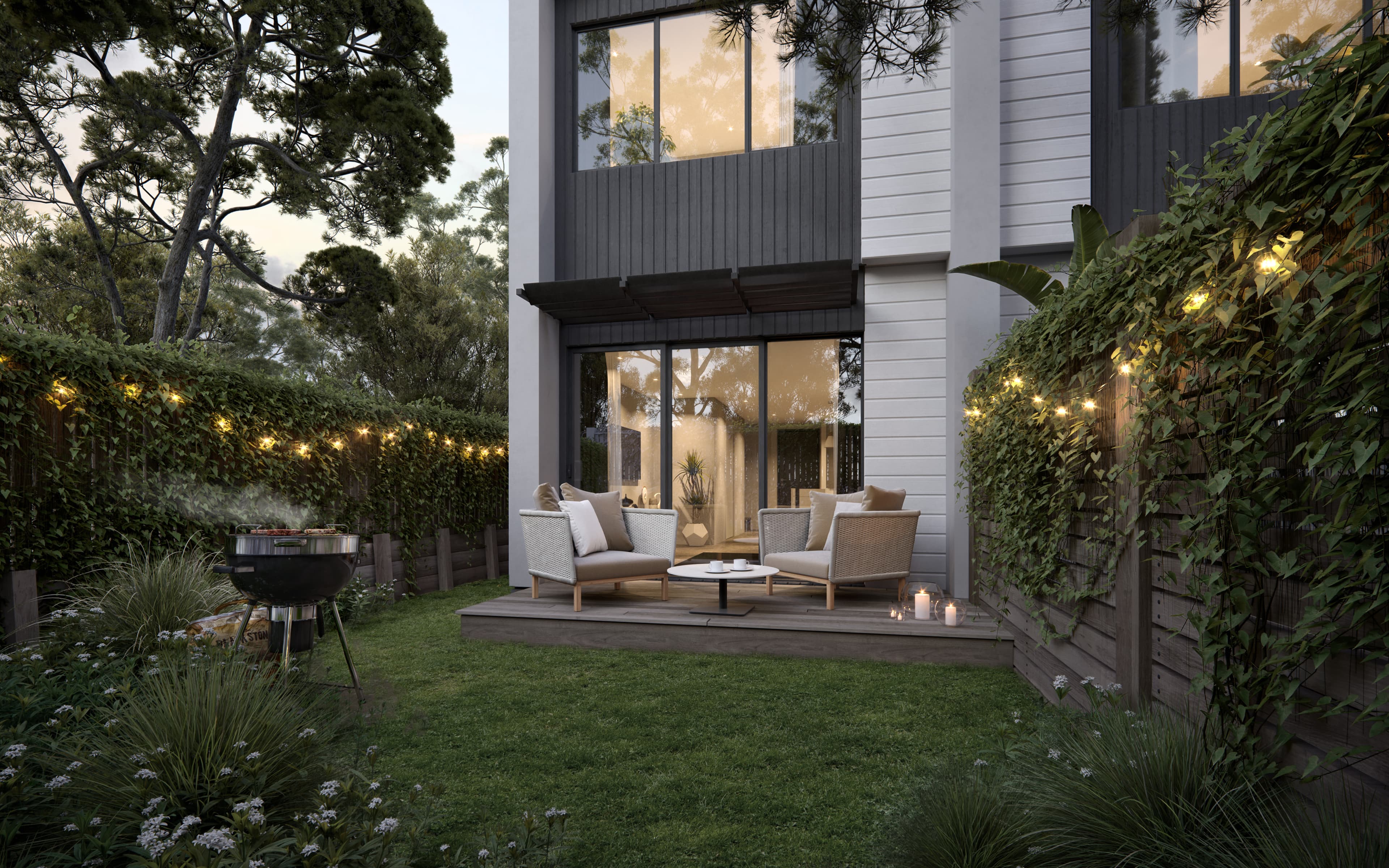 Tudor Residences backyard and deck render at dusk.