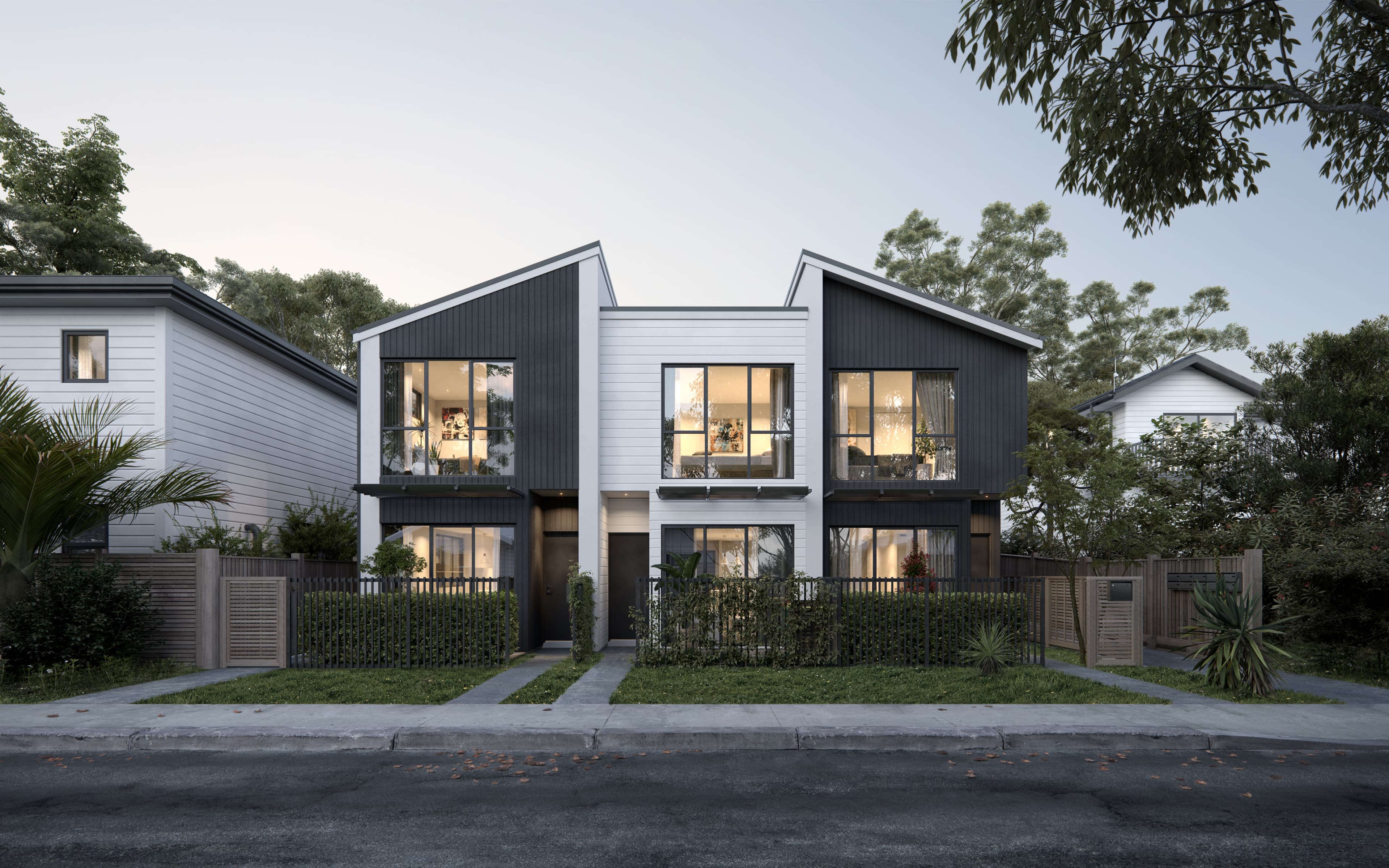 Architectural render of Tudor Residences exterior at dusk.