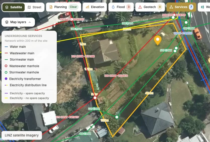 Example site check from Creston Property's feasibility tool: an aerial map of an Auckland site with the parcel boundary and boundary lengths, underground water, wastewater and stormwater mains with pipe sizes, manholes, and electricity lines with spare capacity.